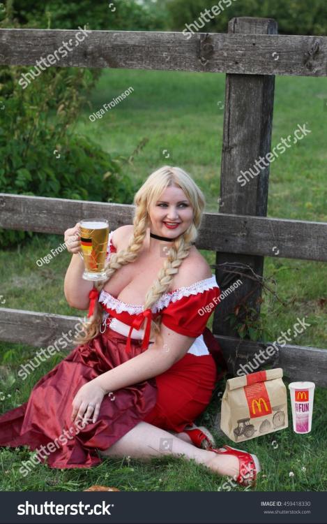 stock-photo-blonde-bavarian-female-holding-a-glass-of-beer-wearing-a-dirndl-459418330.thumb.jpg.a55506df5c615f67e62197e8216ed0e4.jpg